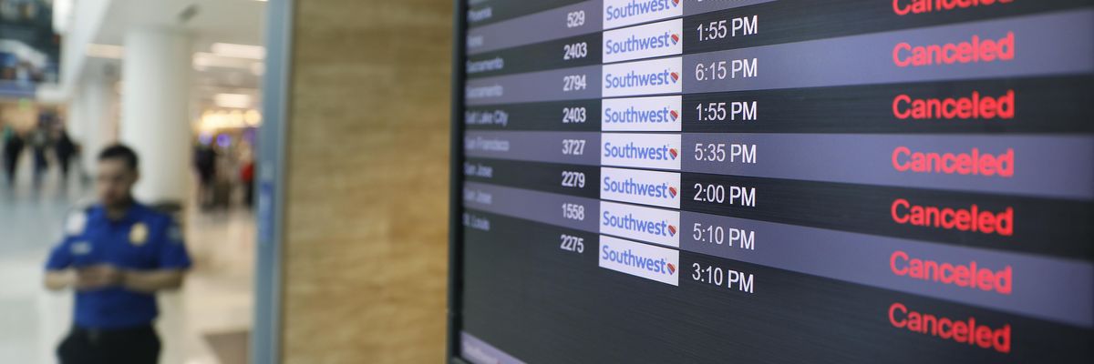 Canceled Southwest Airlines flights appear on the monitors at LAX