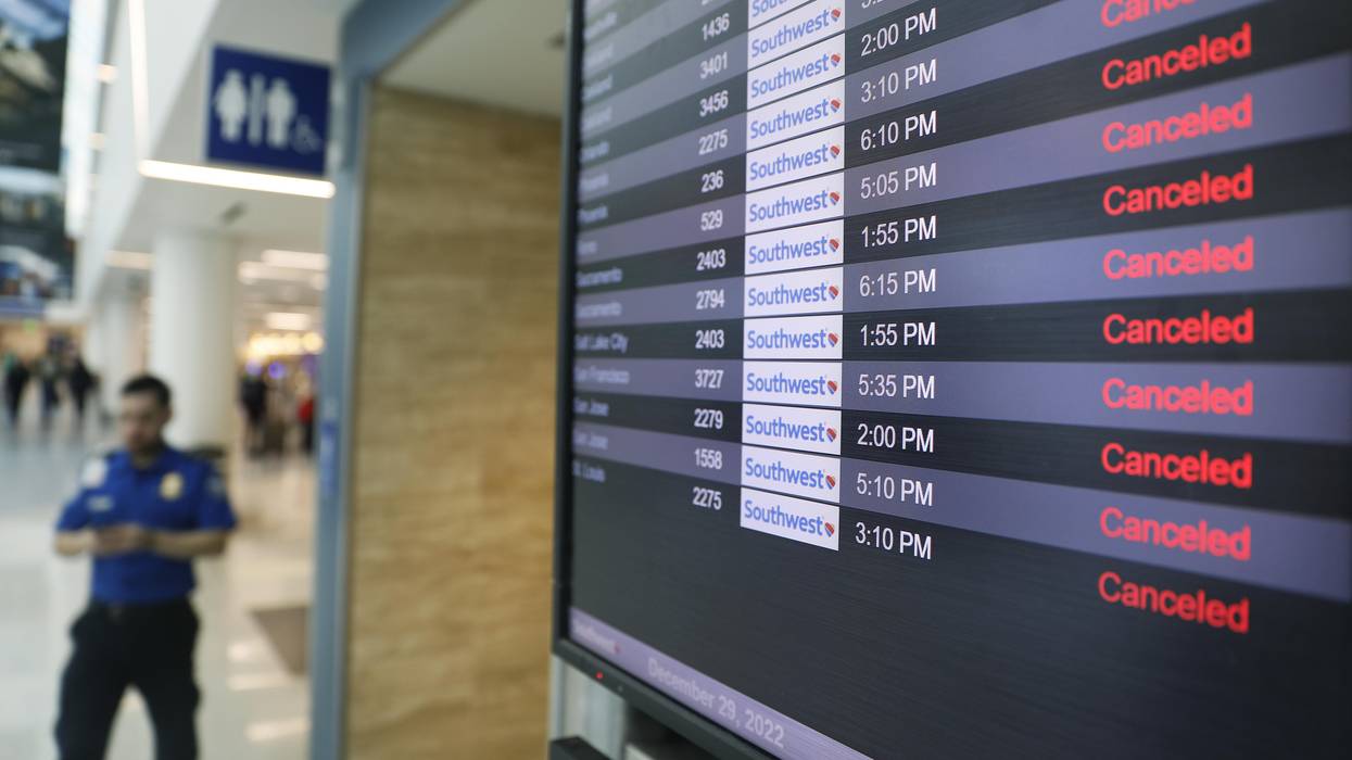 Canceled Southwest Airlines flights appear on the monitors at LAX