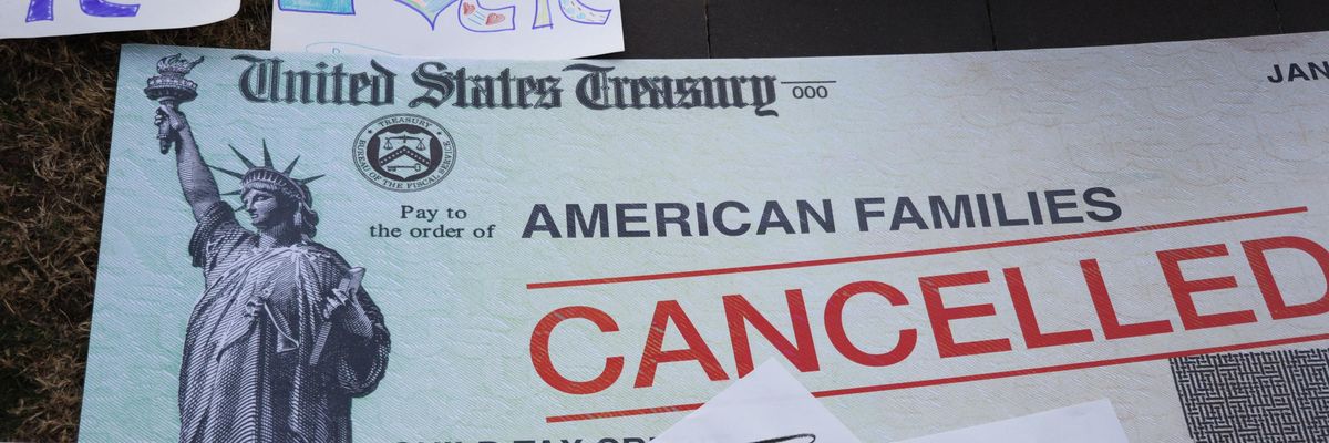 Cancelled check prop at protest for Child Tax Credit