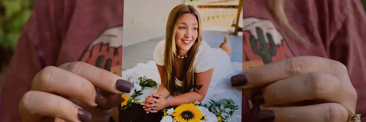 Candace Fails holds a photograph of her daughter, Nevaeh Crain