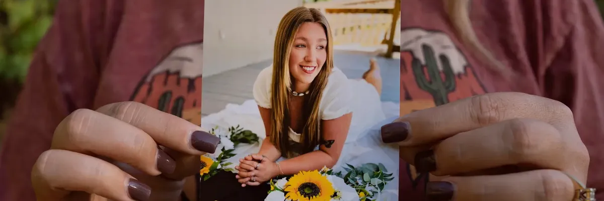 Candace Fails holds a photograph of her daughter, Nevaeh Crain