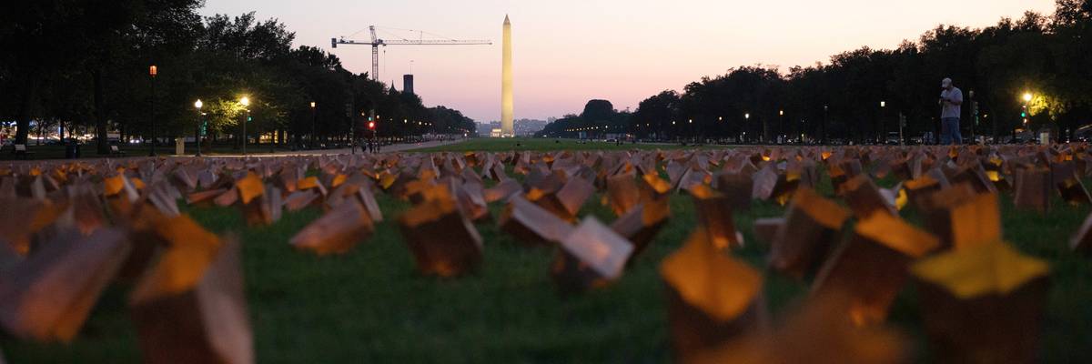 Candles lit in Medicaid vigil.