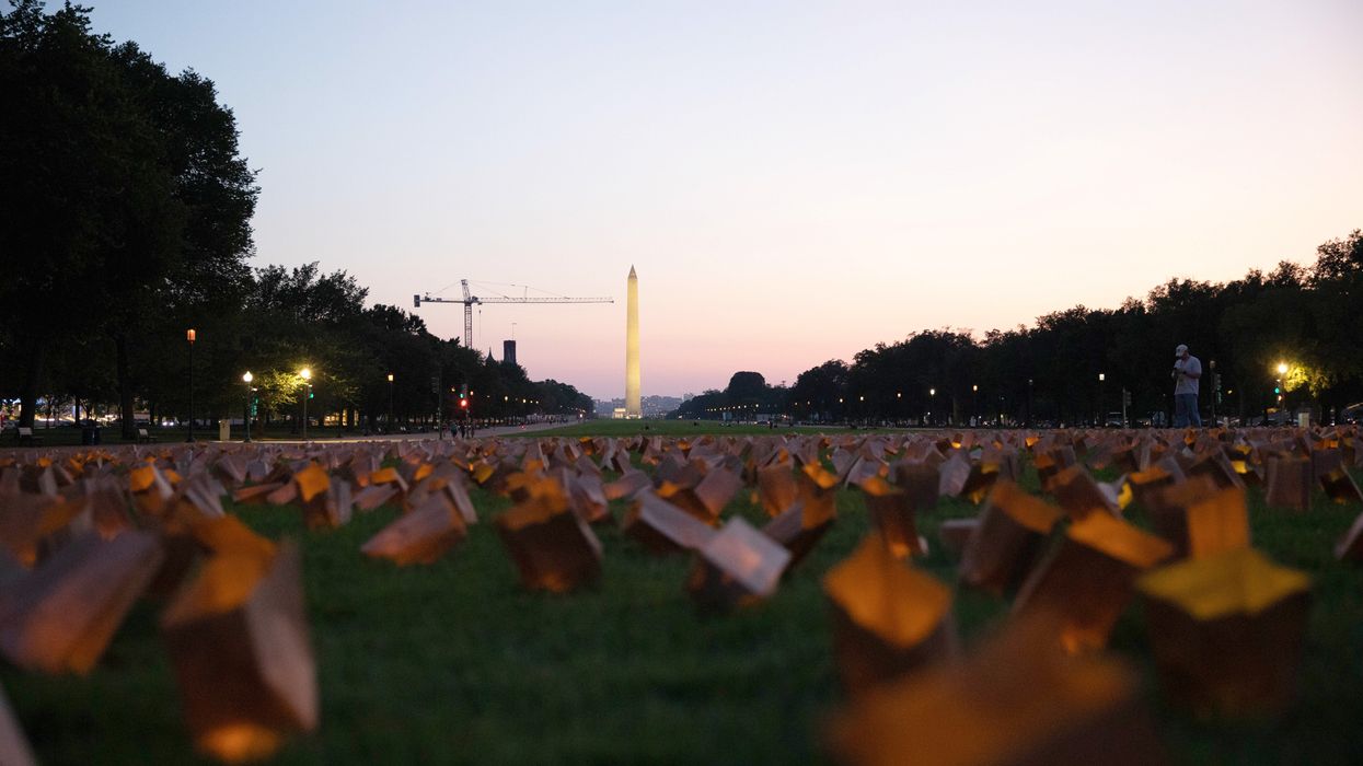 Candles lit in Medicaid vigil.
