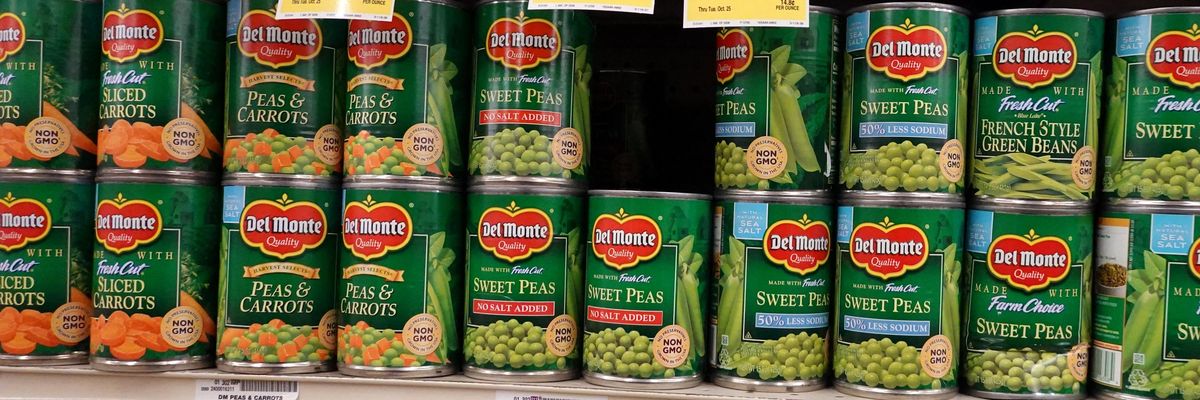 Canned vegetables on a grocery store shelf