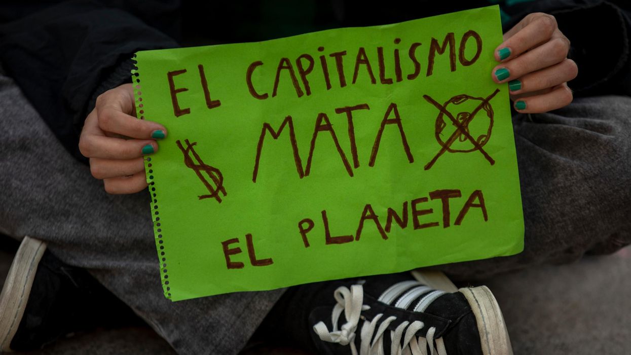Capitalism kills the planet sign