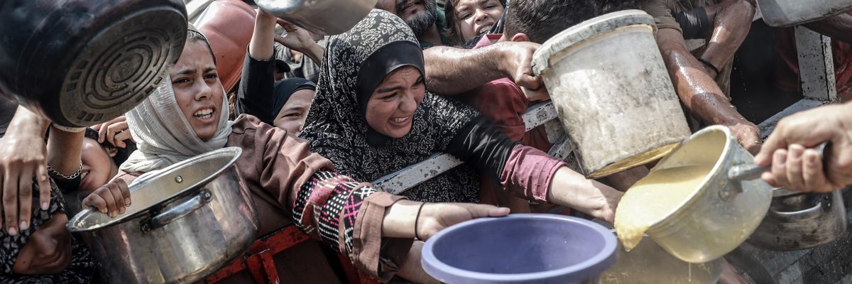 Carrying pots in their hands, Palestinians struggle to access food