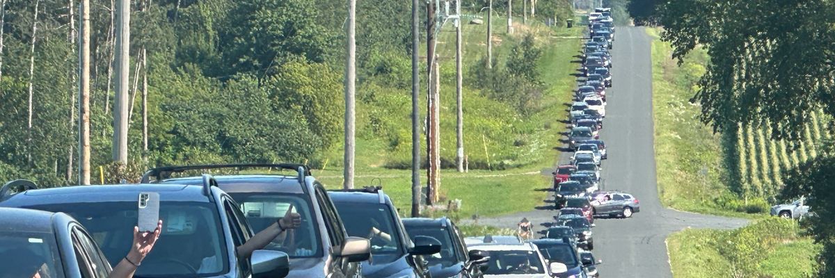 Cars line up in Eau Claire, Wisconsin in advance of a campaign rally