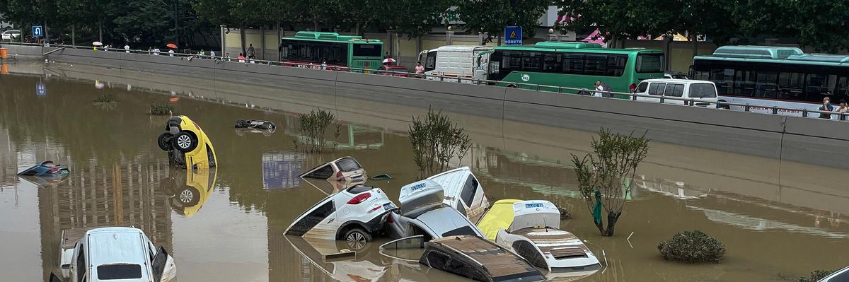 Cars sit in floodwaters after heavy rains hit the city of Zhengzhou in China's central Henan province on July 21, 2021. (Photo: STR/AFP via Getty Images)