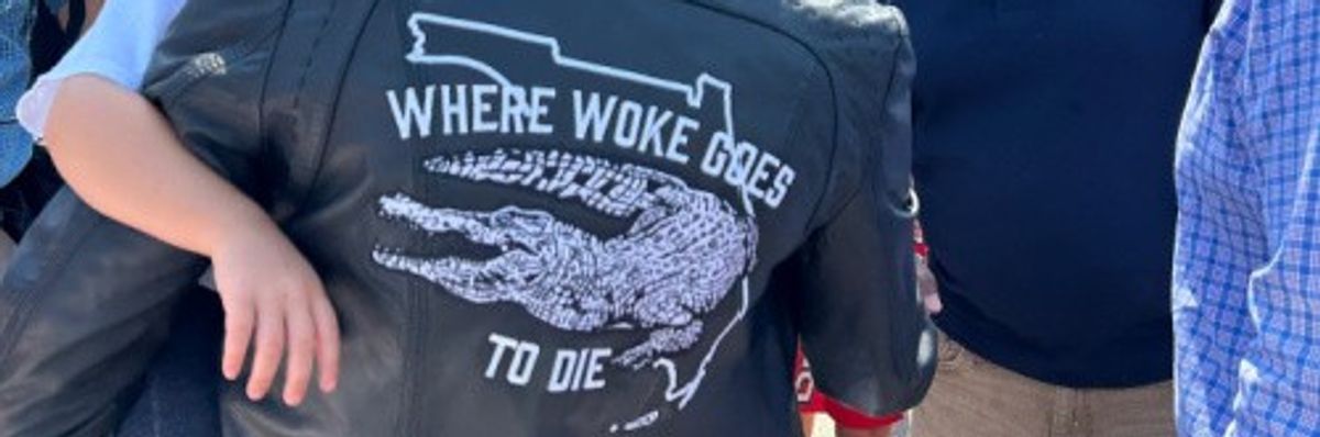 Casey DeSantis wears a leather jacket that reads "Where Woke Goes To Die"