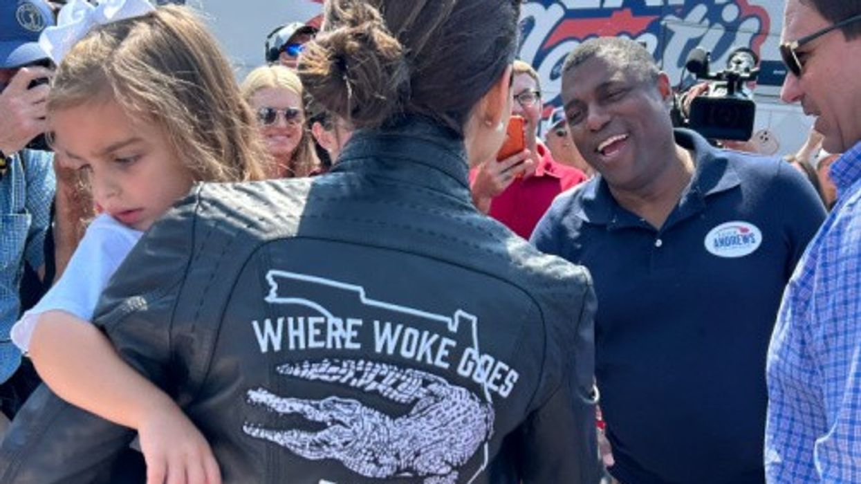 Casey DeSantis wears a leather jacket that reads "Where Woke Goes To Die"