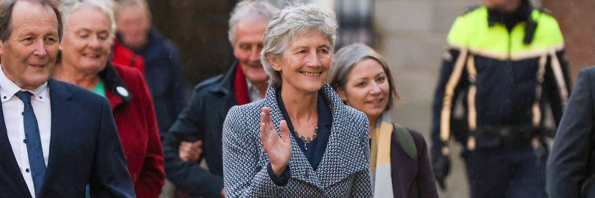Catherine Connolly waves after winning Irish election.