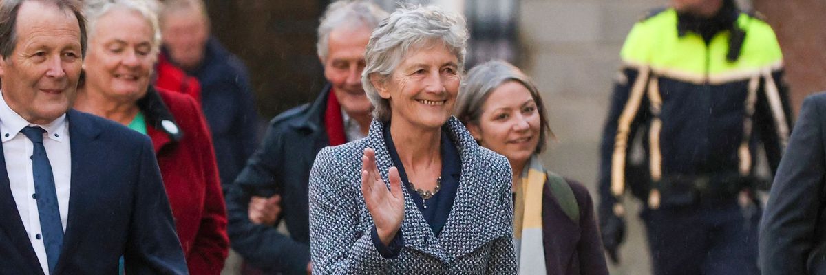 Catherine Connolly waves after winning Irish election.