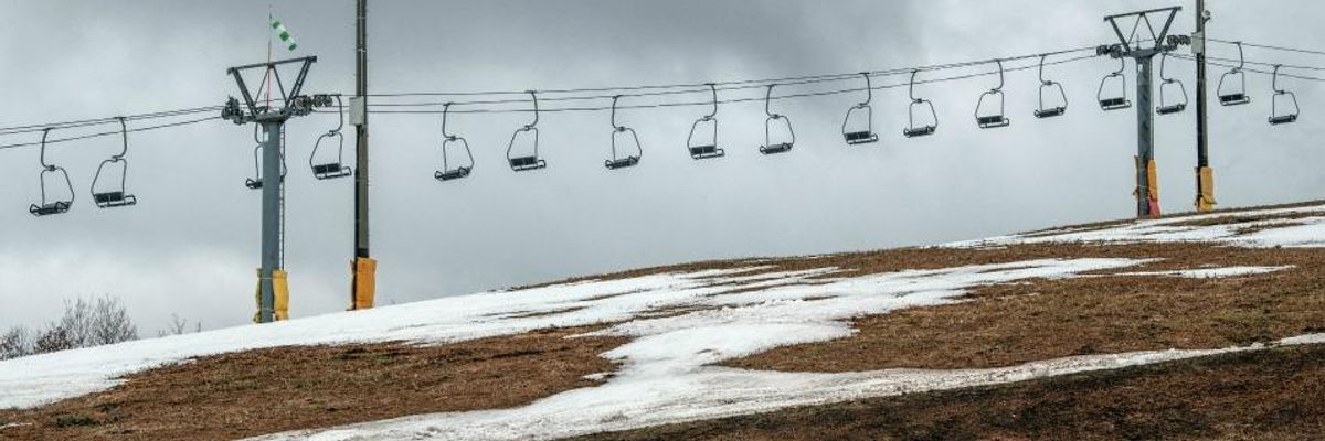 Chair lifts sit empty at a ski resort that has had to close a number of slopes because of a lack of snow, on January 30, 2020 in Minamiuonuma, Japan