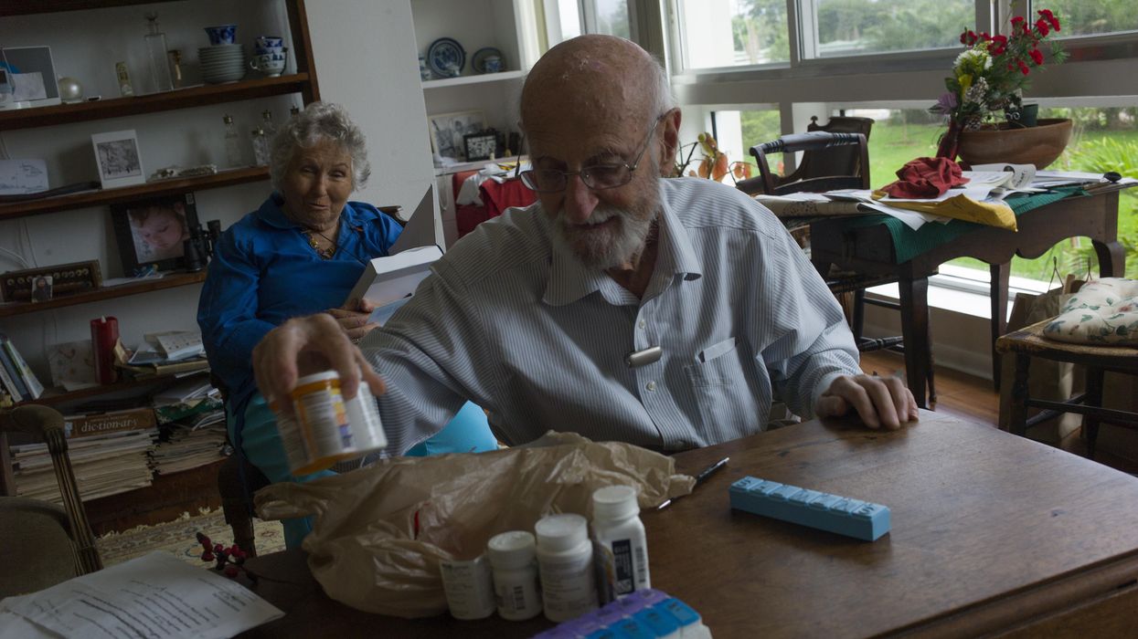 Charles Miller, 90, prepares the daily pills his wife will need for the week on January 4, 2020, in Sarasota, Florida. After suffering a stroke and heart attack, his wife needs approximately ten different medicines daily which need to be carefully monitored. (Photo: Andrew Lichtenstein/Corbis via Getty Images)