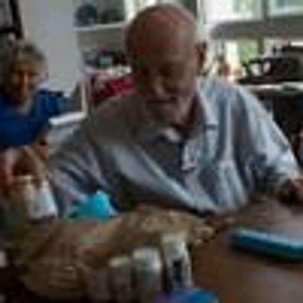 Charles Miller, 90, prepares the daily pills his wife will need for the week on January 4, 2020 in Sarasota, Florida. His wife has had a recent stroke and a heart attack, and needs approximately ten different medicines daily which need to be carefully monitored. (Photo: Andrew Lichtenstein/Corbis via Getty Images)