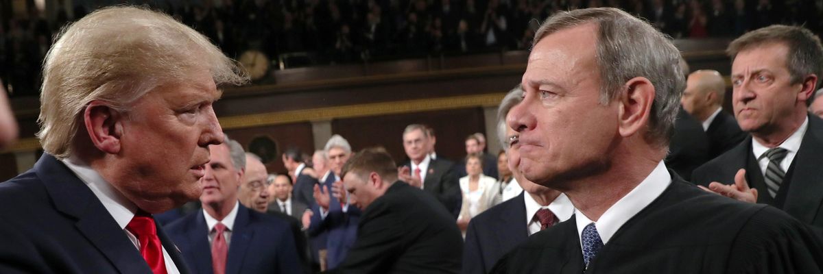 Chief Justice John Roberts shaking hands with former President Donald Trump