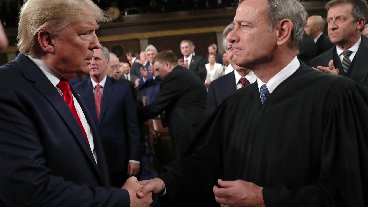 Chief Justice John Roberts shaking hands with former President Donald Trump
