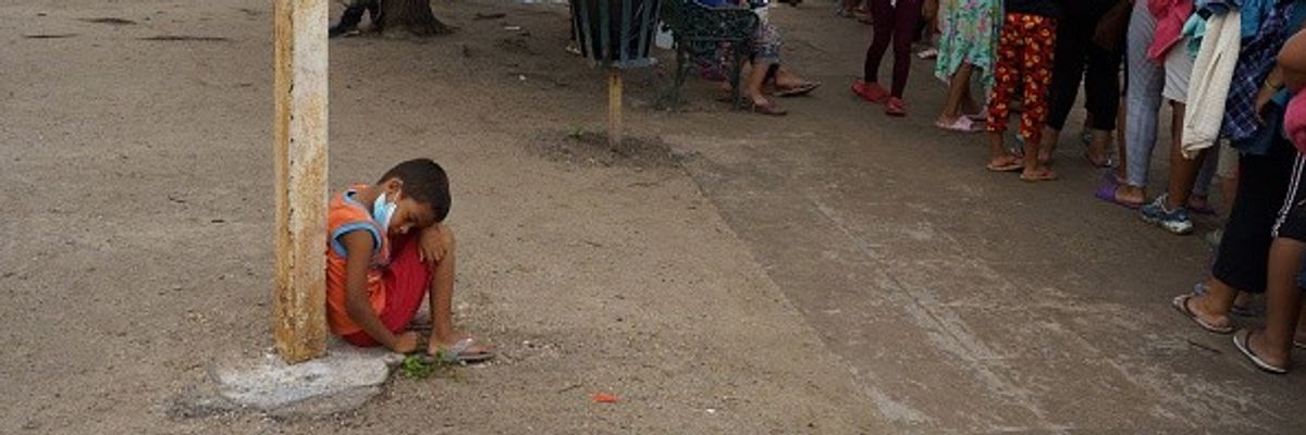 Child in Mexican migrant camp.