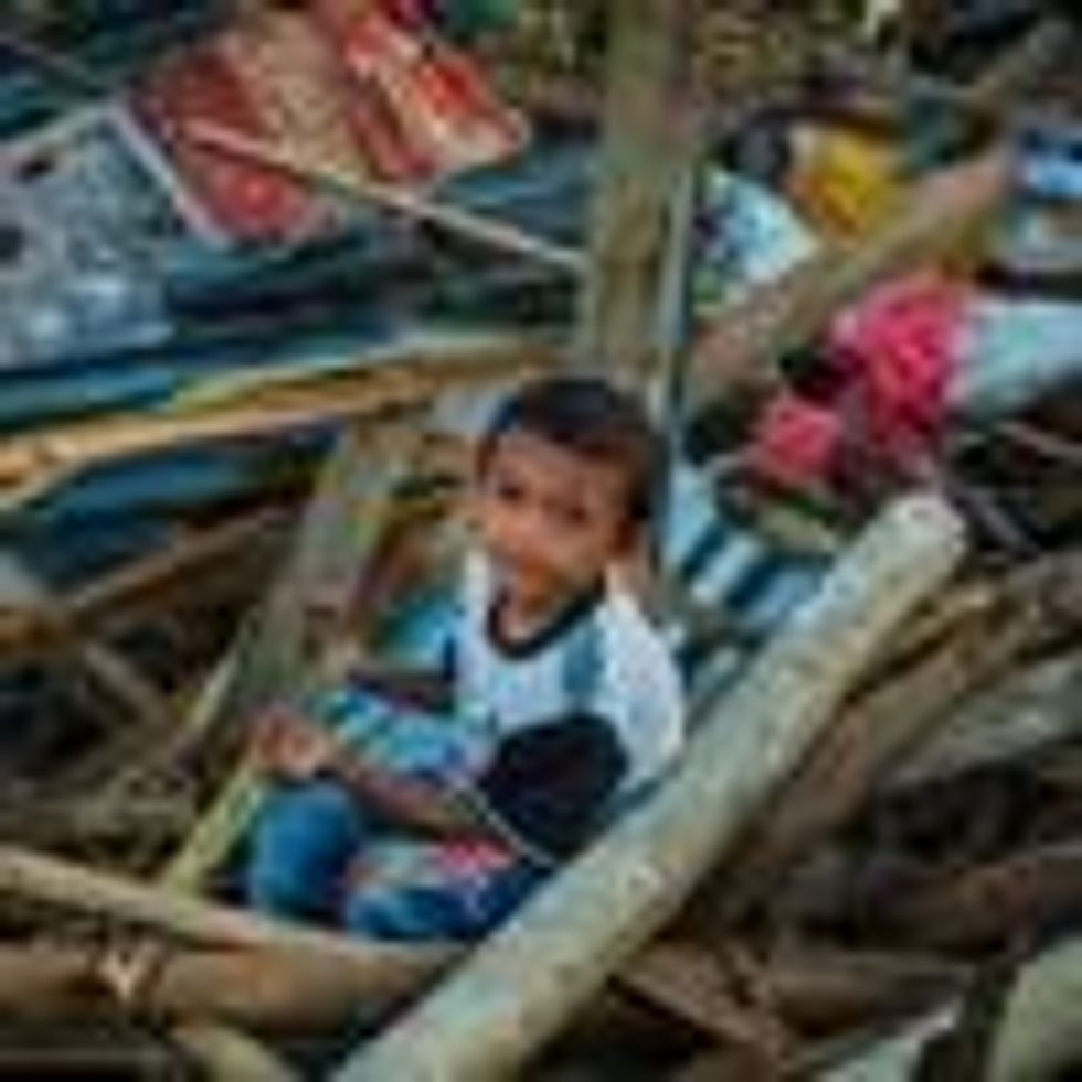 Child in typhoon debris