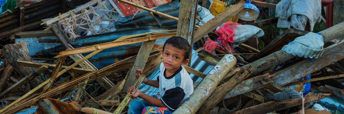 Child in typhoon debris