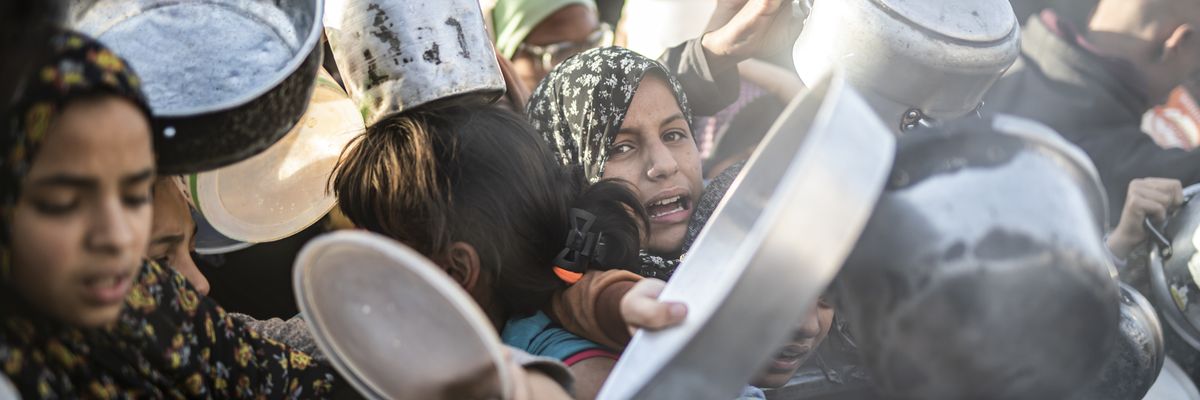Children gather to receive food in Rafah, Gaza