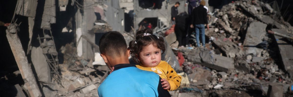Children in rubble in Gaza.