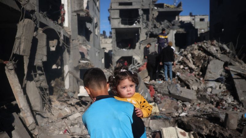 Children in rubble in Gaza.