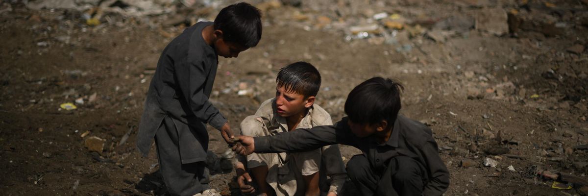 Children look for scrap metal in Afghanistan