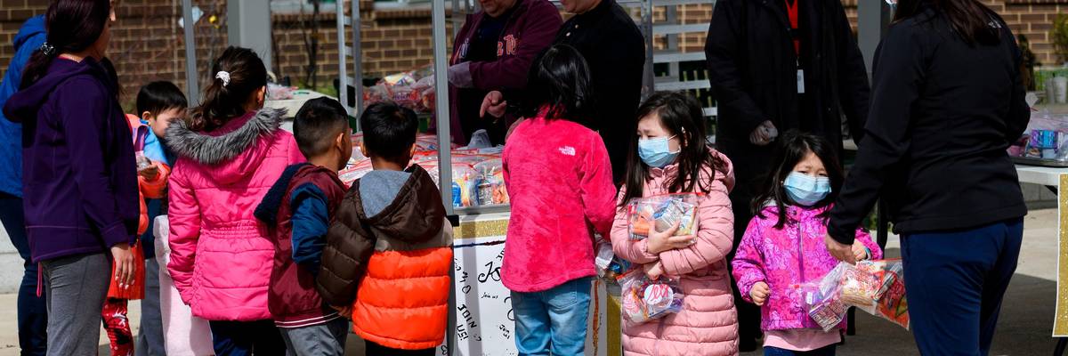 Children pick up free school lunches
