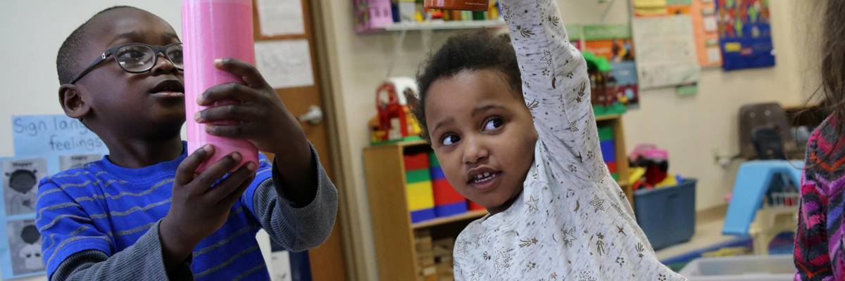 Children play a game at a child care center.