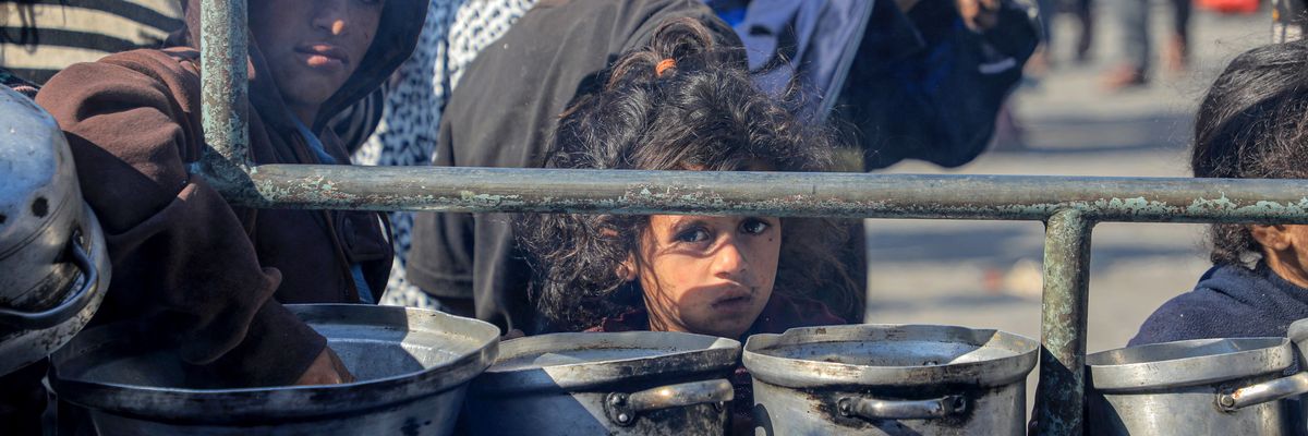 Children wait for food relief