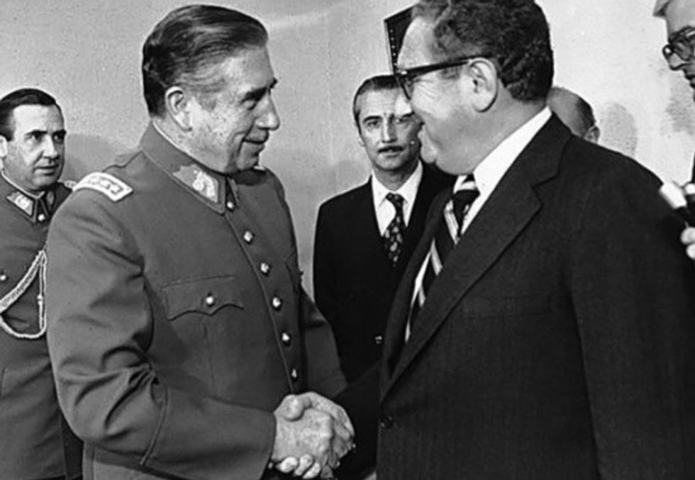 Chile's dictator Augusto Pinochet and Henry Kissinger shake hands in 1976
