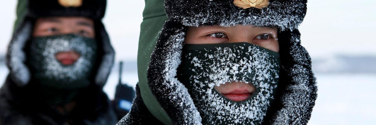 Chinese paramilitary police border guards train in the snow at Mohe County in China's northeast Heilongjiang province, on the border with Russia, on December 12, 2016.