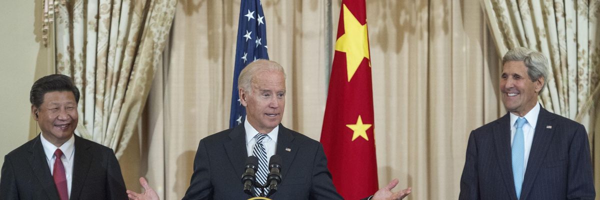 Chinese President Xi Jinping and then-U.S. Secretary of State John Kerry listen as then-U.S. Vice President Joe Biden speaks during a luncheon hosted by Kerry on September 25, 2015 in Washington, D.C. (Photo: Paul J. Richards/AFP via Getty Images)