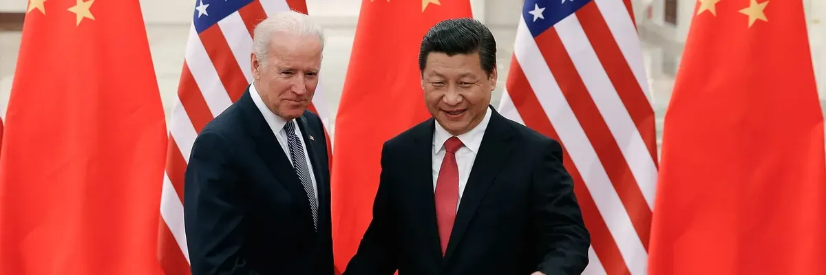 Chinese President Xi Jinping and then–Vice President Joe Biden shake hands.