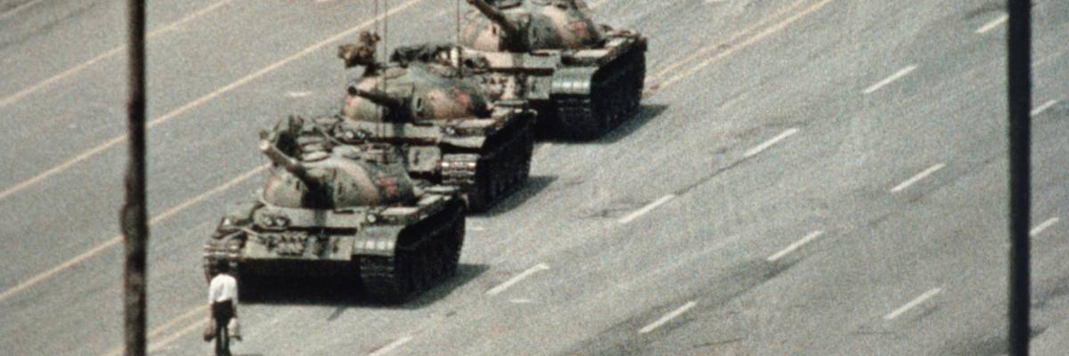 Chinese protester stands before tanks at 1989 protests in Tiananmen Square.