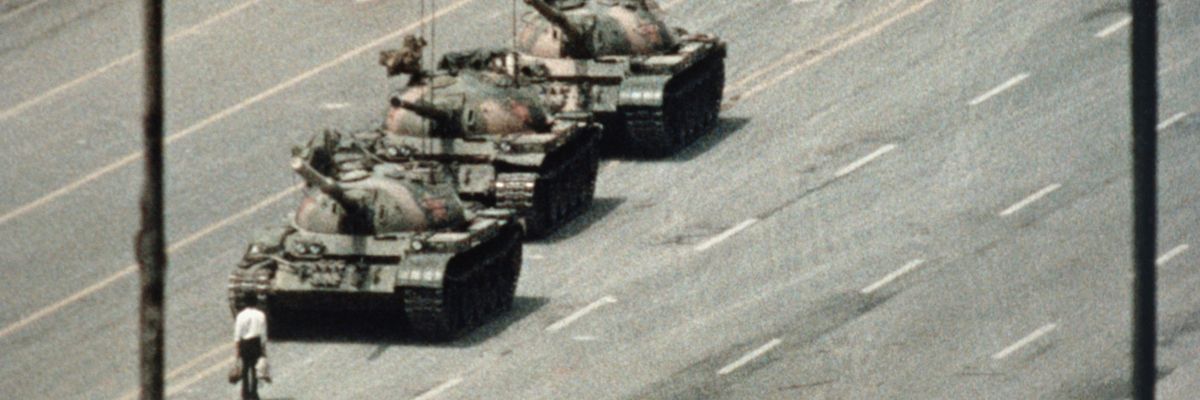 Chinese protester stands before tanks at 1989 protests in Tiananmen Square.