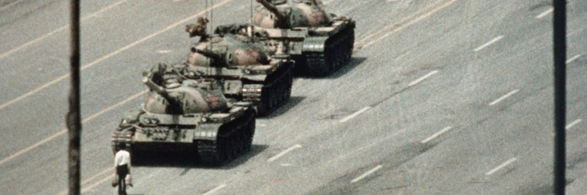 Chinese protester stands before tanks at 1989 protests in Tiananmen Square. 