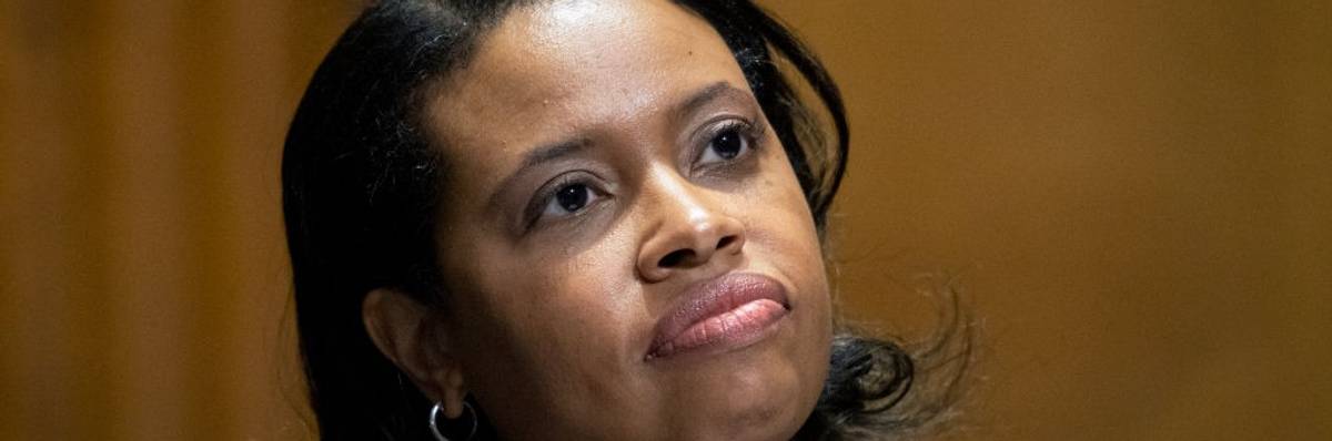 Chiquita Brooks-LaSure in front of a microphone.