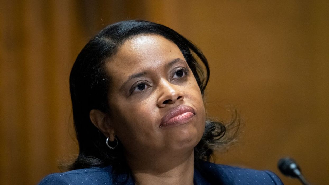 Chiquita Brooks-LaSure in front of a microphone.