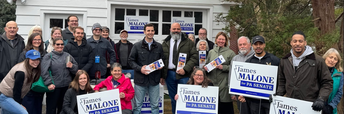 Chris Deluzio and James Malone stand center.