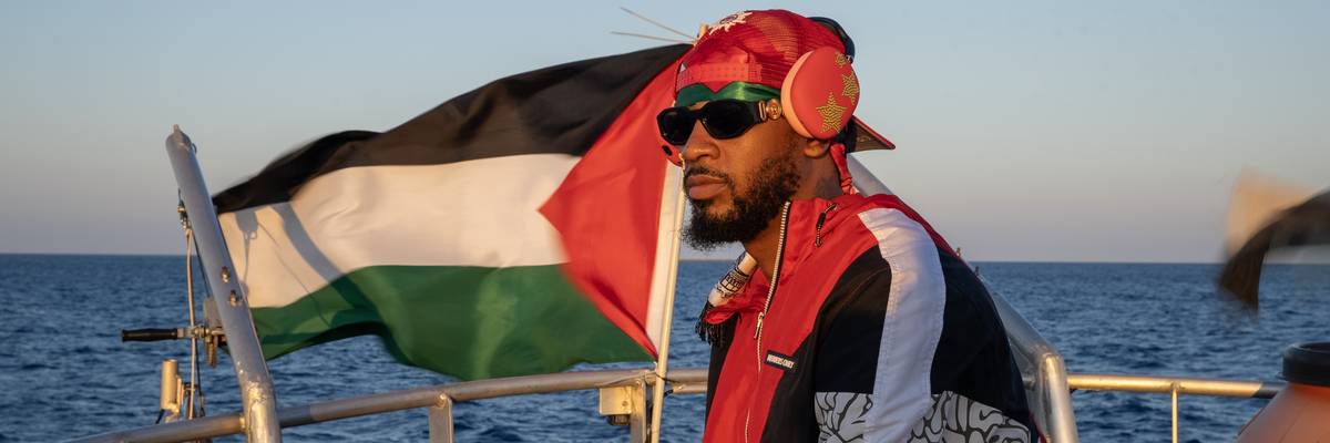 Chris Smalls sails on boat to Gaza.