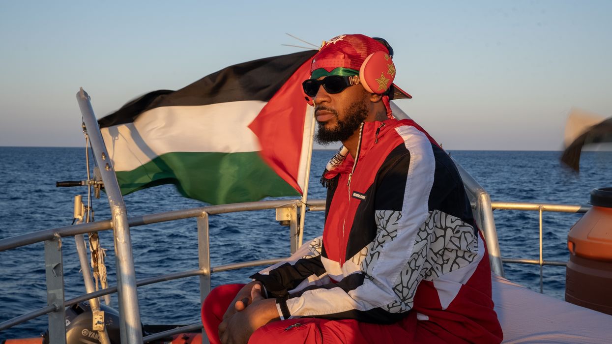 Chris Smalls sails on boat to Gaza.