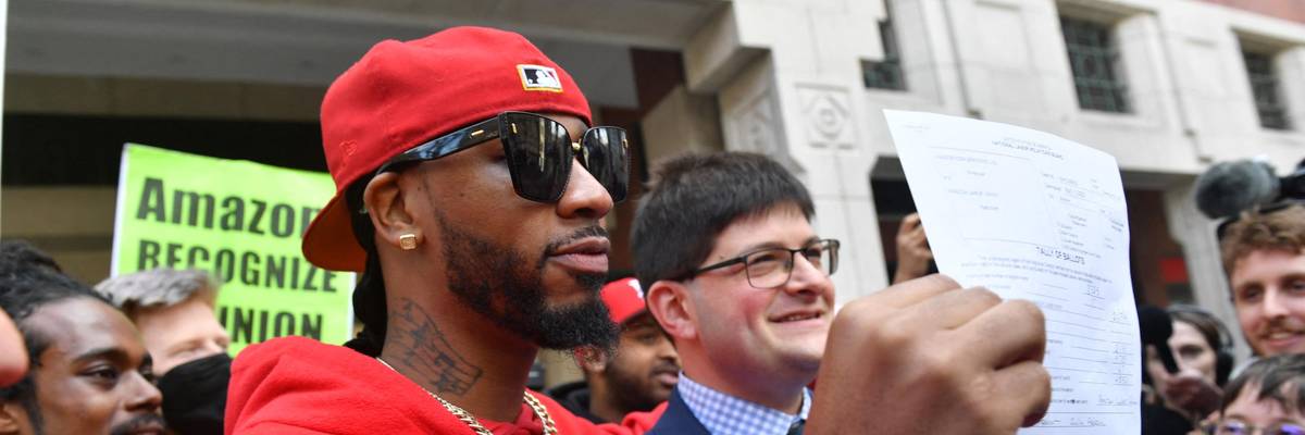 Christian Smalls celebrates with Amazon workers