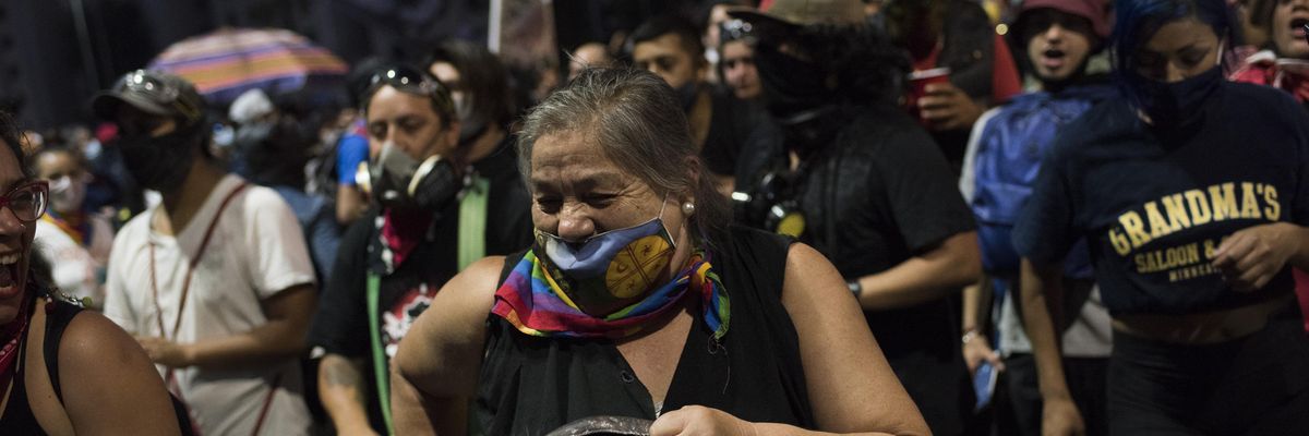 Citizens in favor of rewriting the Chilean constitution celebrate while awaiting the official results of the referendum at Plaza Italia Square in Santiago, Chile on October 25, 2020. (Photo: Alejandro Olivares/Anadolu Agency via Getty Images)