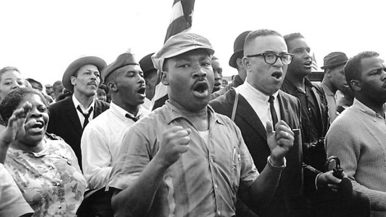 Civil rights activists led by Dr. Martin Luther King sing as they march from Selma to Montgomery in 1965.