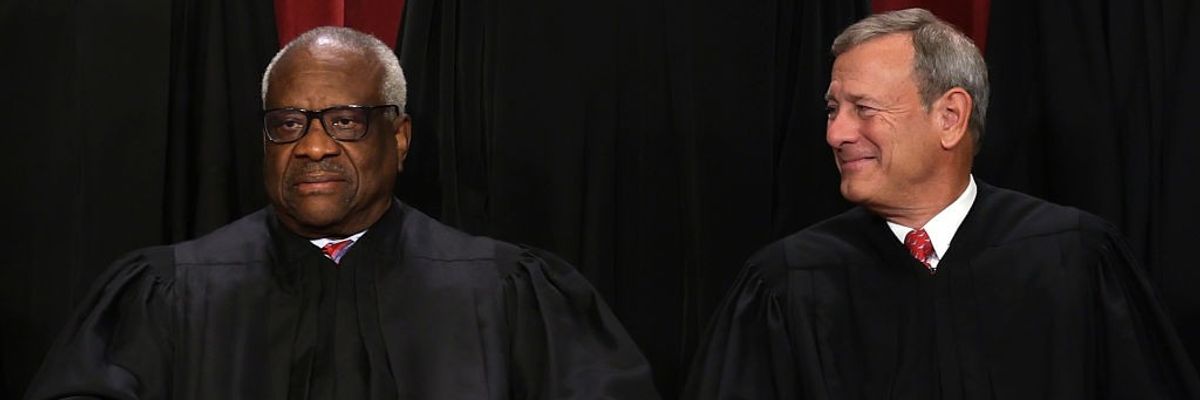 Clarence Thomas and John Roberts.
