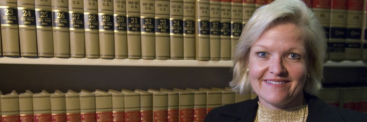 Cleta Mitchell is pictured in the library of a law firm