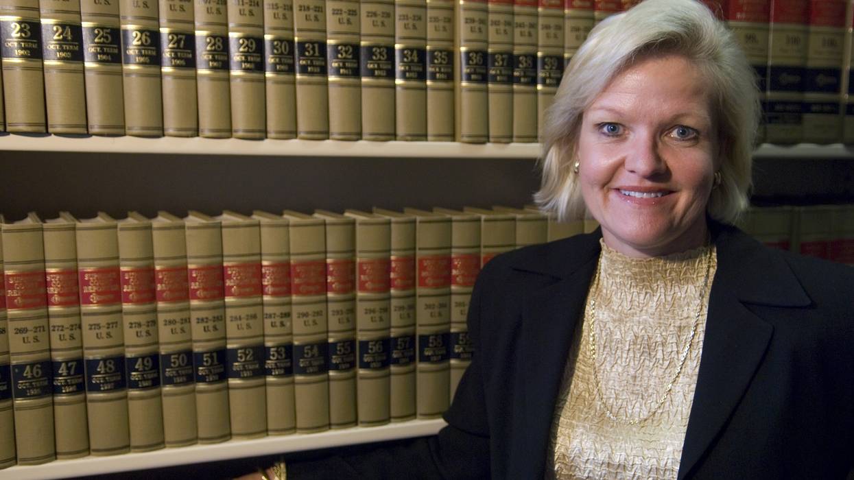 Cleta Mitchell is pictured in the library of a law firm