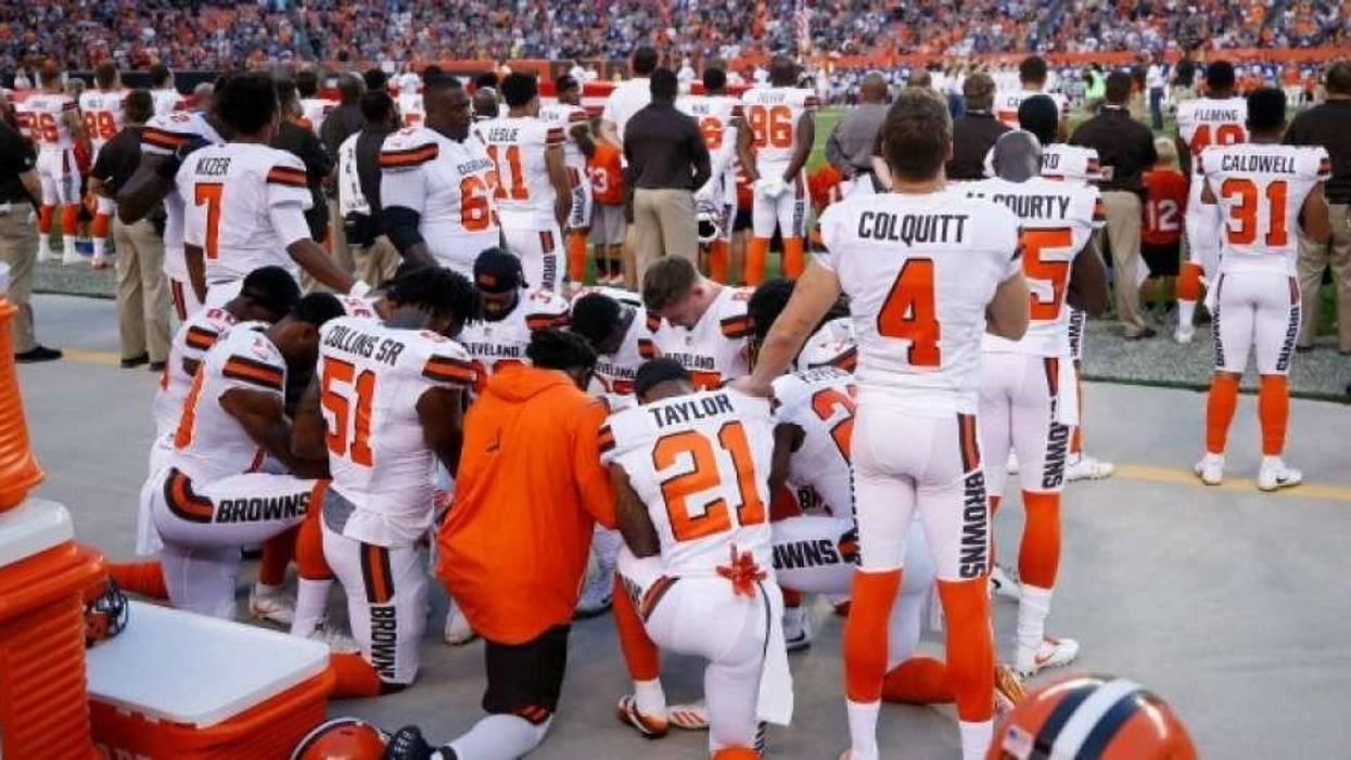 Cleveland Brown players take a knee